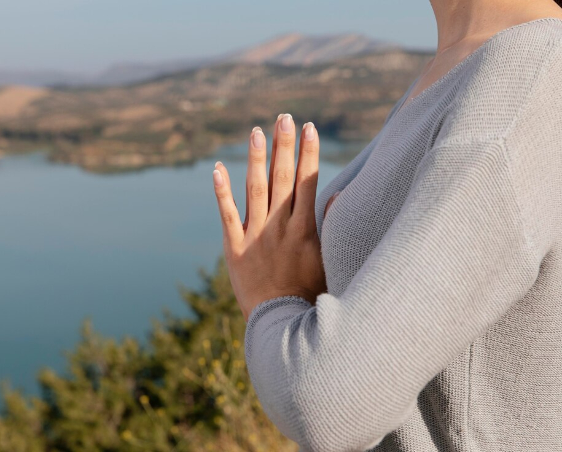 side-view-woman-meditating-nature_23-2148940308