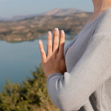 side-view-woman-meditating-nature_23-2148940308