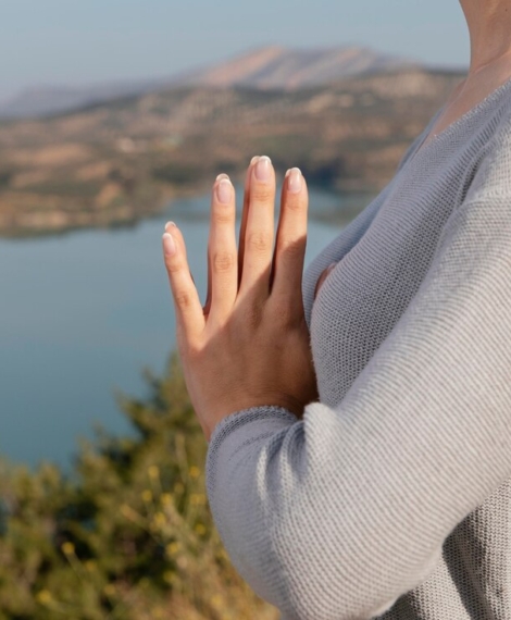 side-view-woman-meditating-nature_23-2148940308