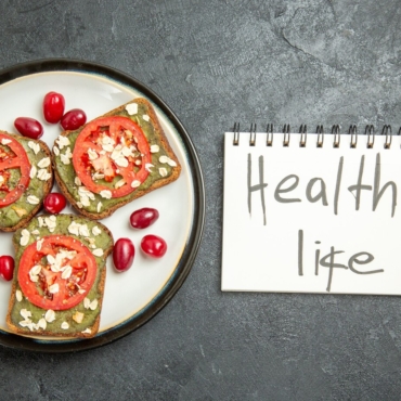 top-view-delicious-sandwiches-with-sliced-tomatoes-healthy-life-writing-grey-surface-snack-bun-burger-sandwich-bread_140725-85905